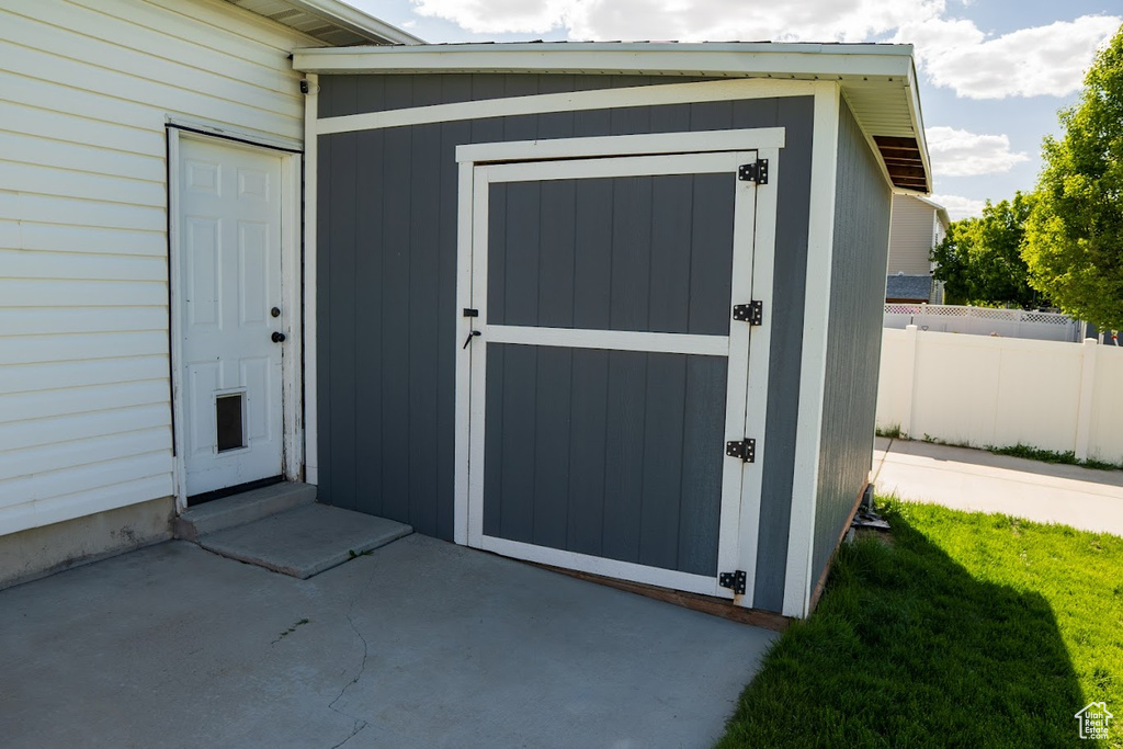 View of exterior entry featuring a patio
