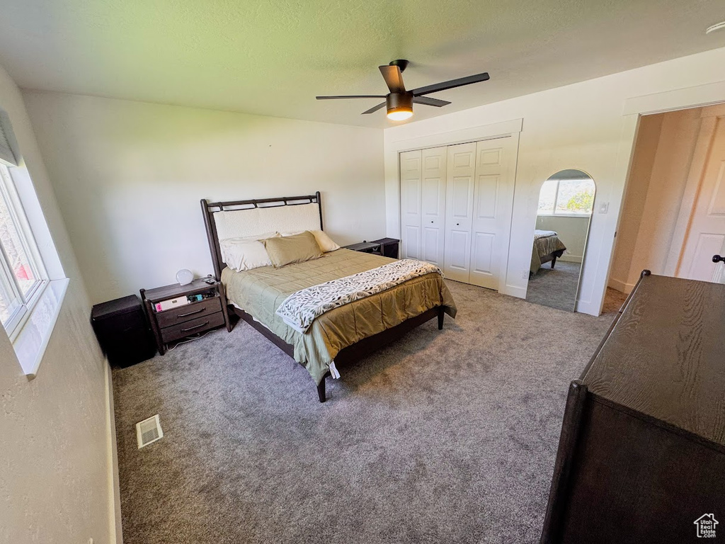 Bedroom with carpet and a ceiling fan