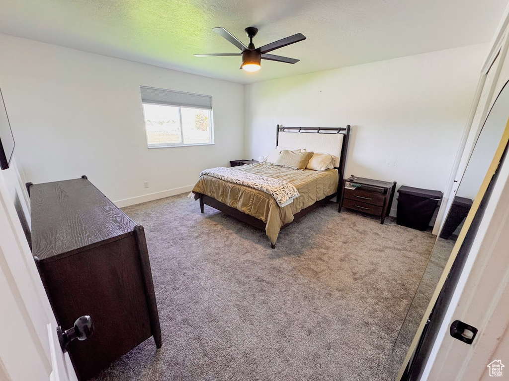 Bedroom featuring carpet and a ceiling fan