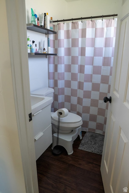 Full bathroom with vanity and wood finished floors