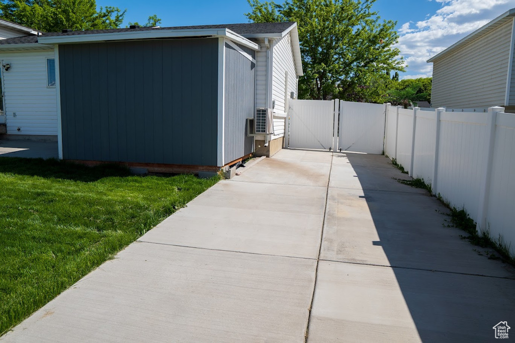 View of home's exterior with a gate
