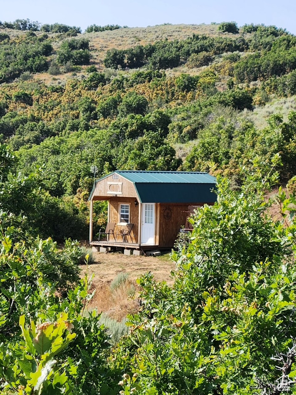 View of shed featuring a forest view