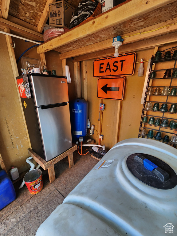 Garage featuring freestanding refrigerator