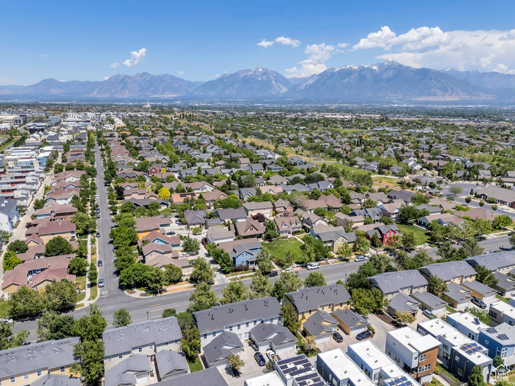 Aerial perspective of suburban area featuring a mountain backdrop