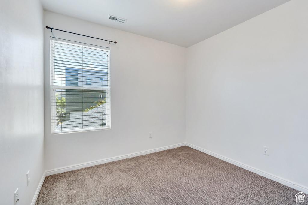 Empty room featuring carpet flooring