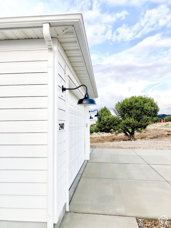 View of property exterior with a garage