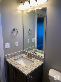 Bathroom featuring vanity and toilet