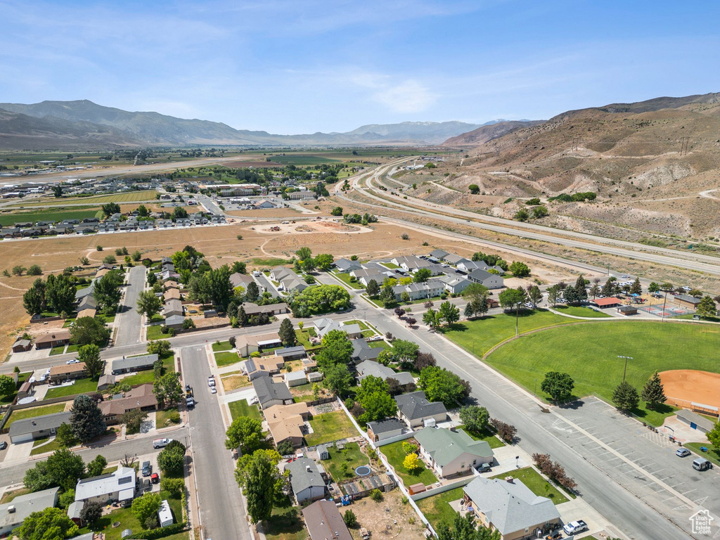 View of property location with a mountainous background and nearby suburban area