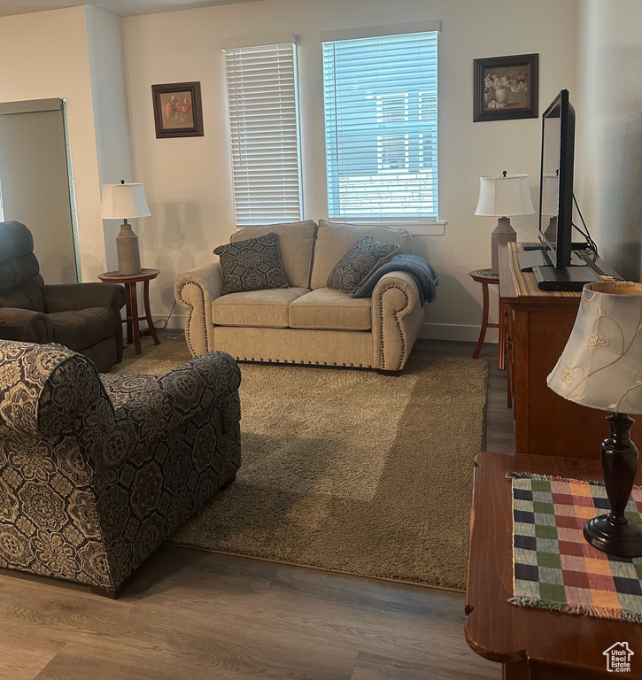 Living room with wood finished floors and baseboards