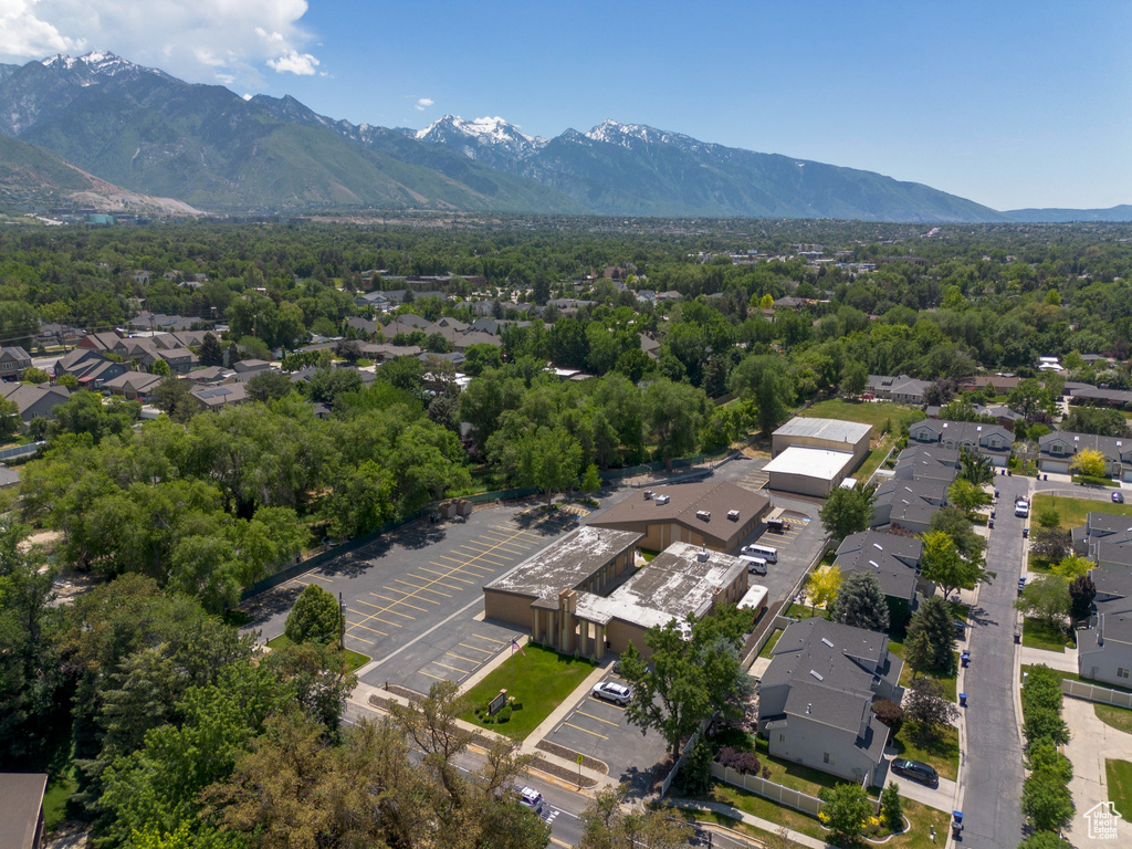 Aerial perspective of suburban area featuring a mountainous background