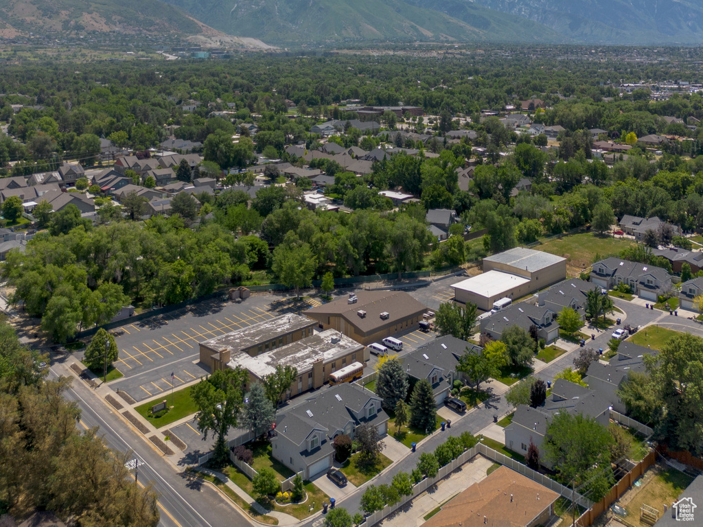Aerial perspective of suburban area featuring a mountainous background