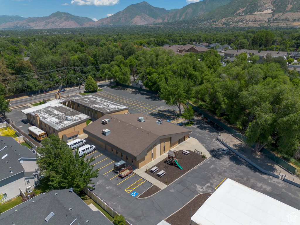 Drone / aerial view of mountains and a heavily wooded area