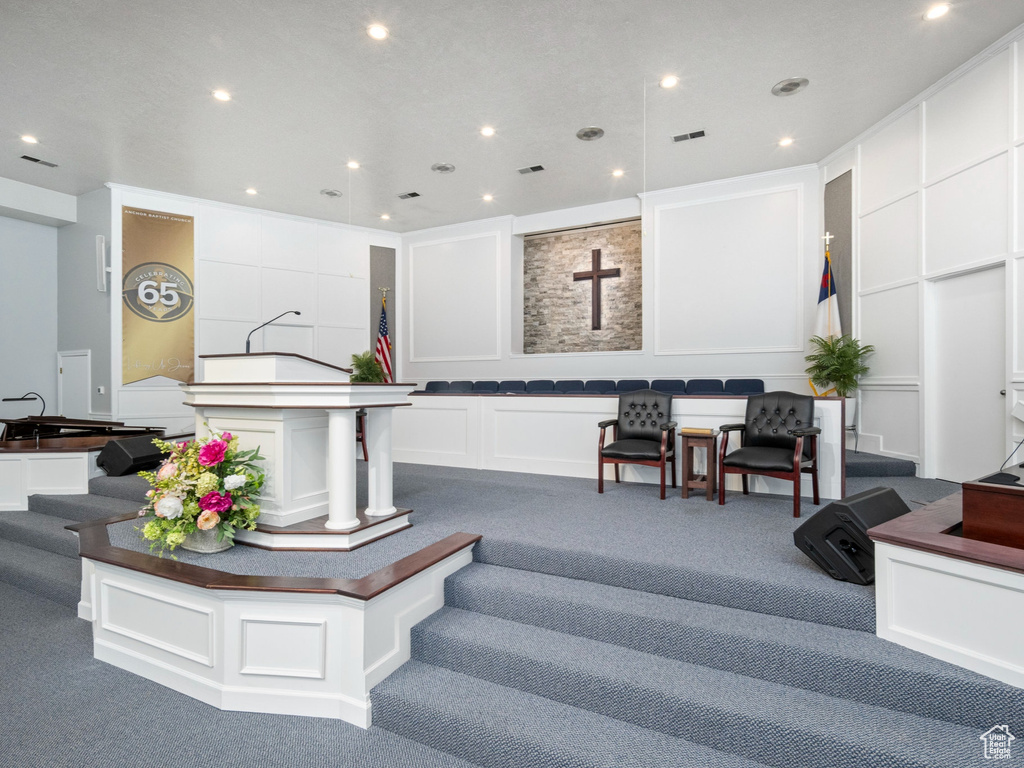 Lobby with a decorative wall and recessed lighting
