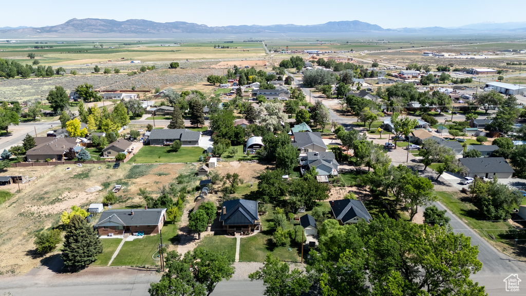 Aerial view of property's location with a mountainous background