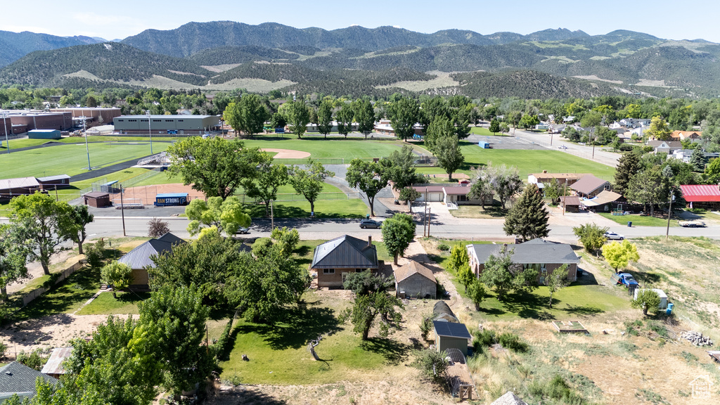 Aerial view of residential area featuring a mountainous background