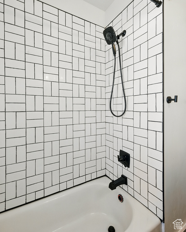 Full bathroom with shower / tub combination