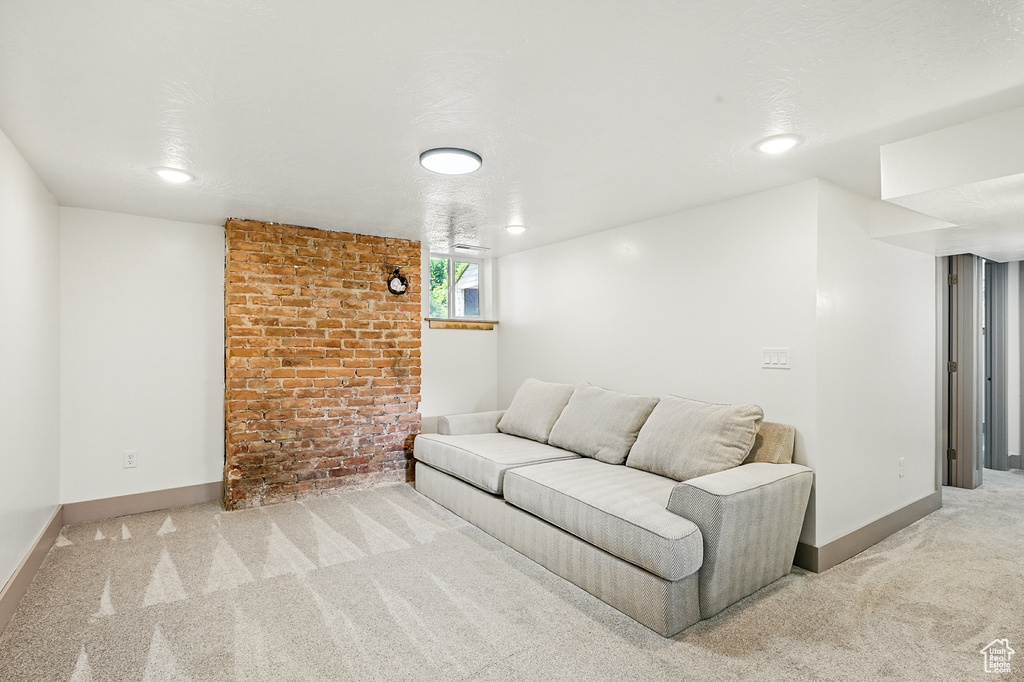 Living room featuring carpet flooring and baseboards