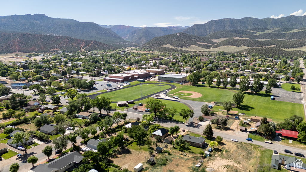 Aerial perspective of suburban area with a mountain backdrop