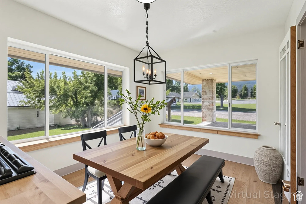 Dining room featuring a chandelier and light wood-type flooring