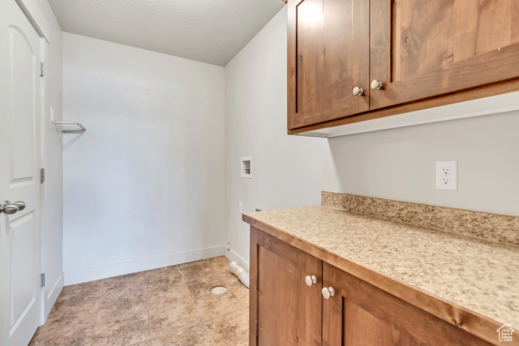 Washroom with cabinet space and washer hookup