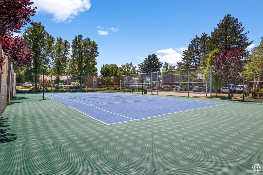 View of tennis court with community basketball court