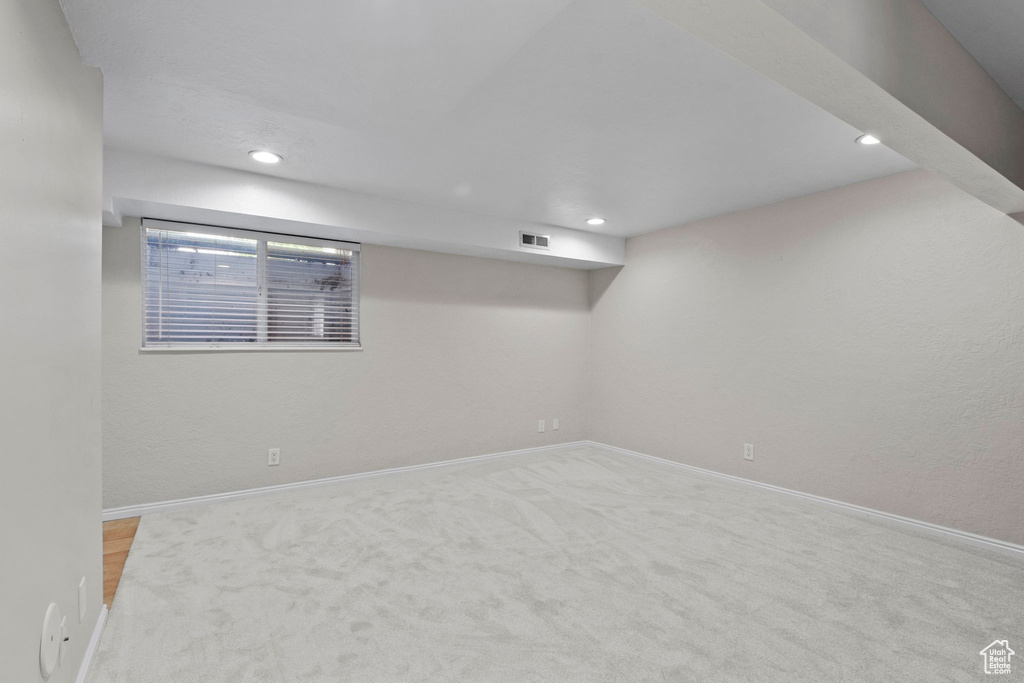 Basement featuring carpet flooring and recessed lighting