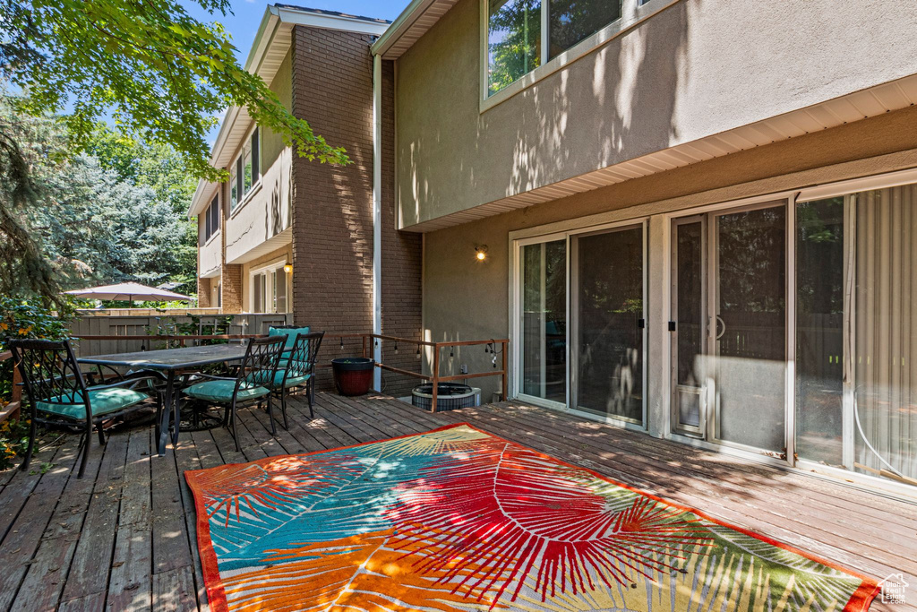 Wooden terrace with outdoor dining space