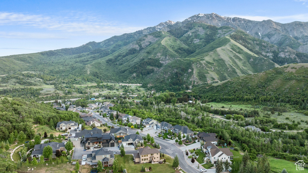 View of property location featuring mountains and nearby suburban area