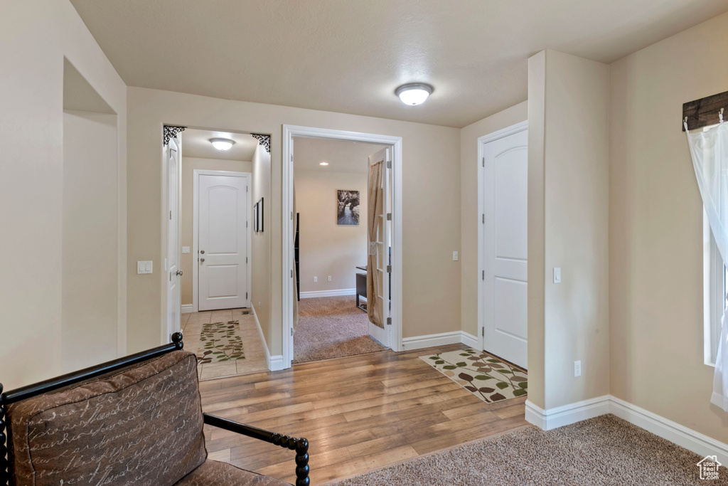 Entrance foyer featuring light wood-style floors and baseboards