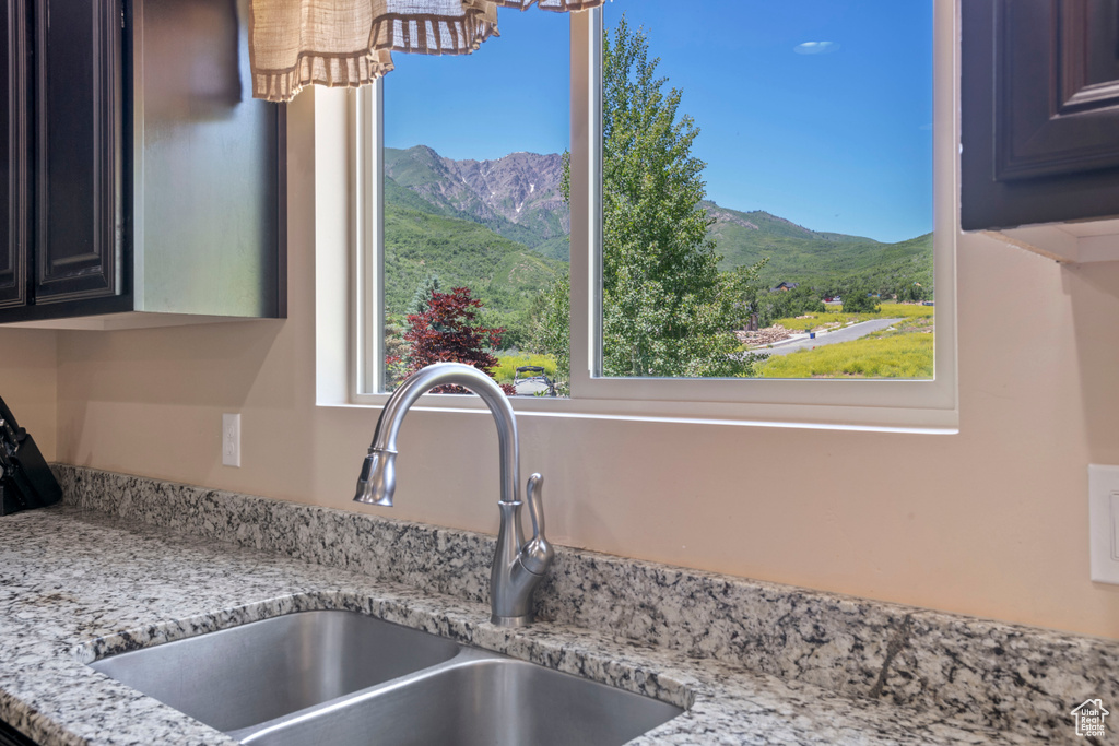 Kitchen view of light stone countertops