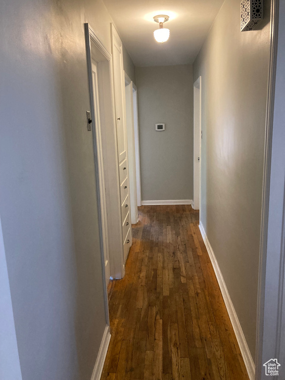 Corridor with dark wood-type flooring