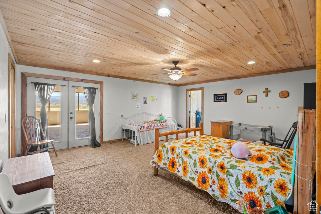 Bedroom with wooden ceiling, access to outside, recessed lighting, carpet flooring, and french doors