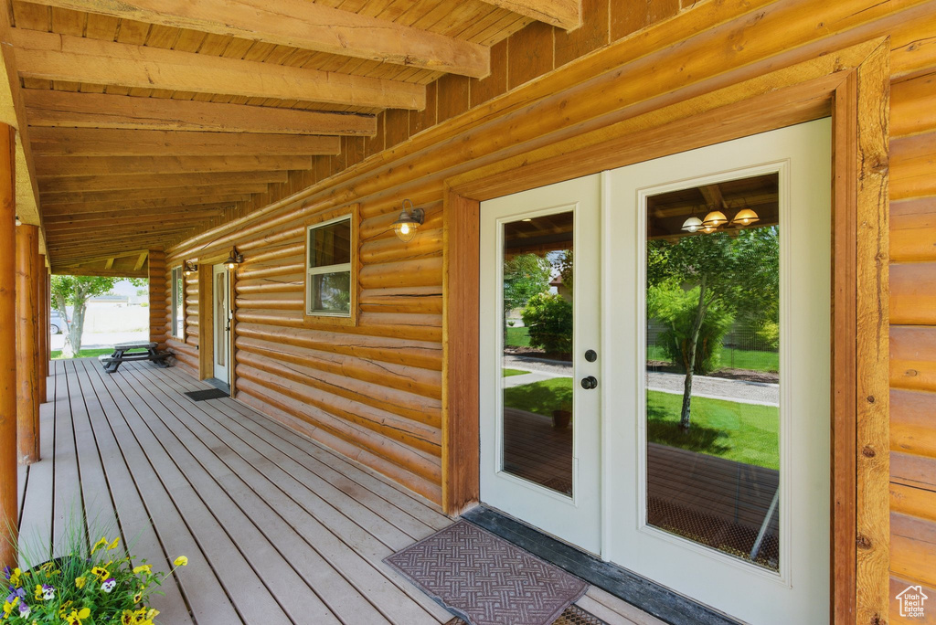 Wooden porch featuring french doors