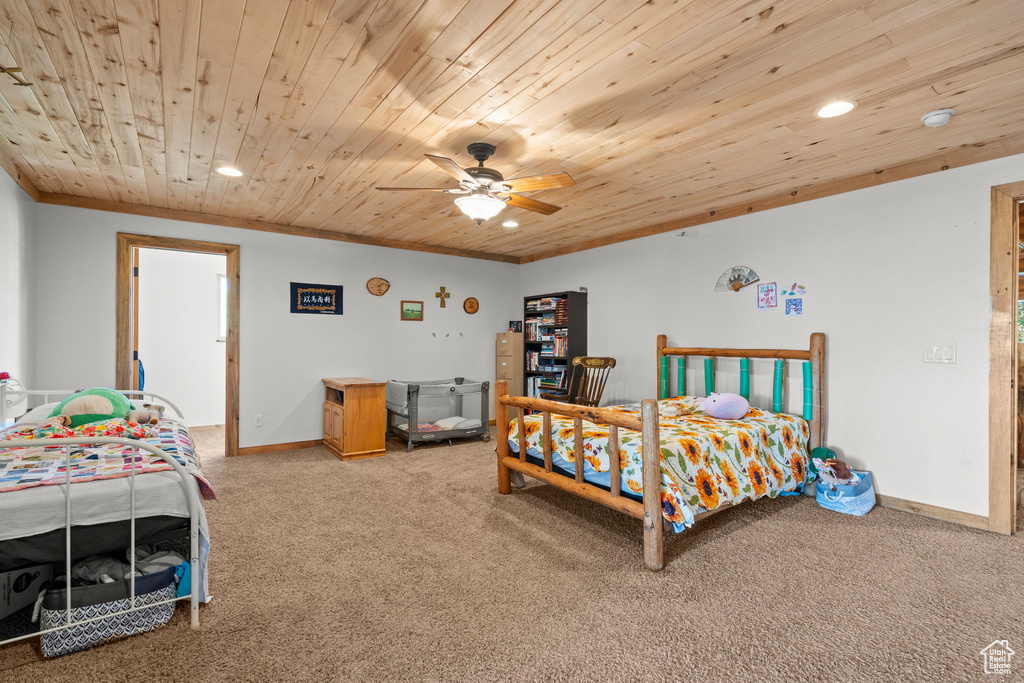Bedroom featuring carpet, recessed lighting, wooden ceiling, crown molding, and ceiling fan