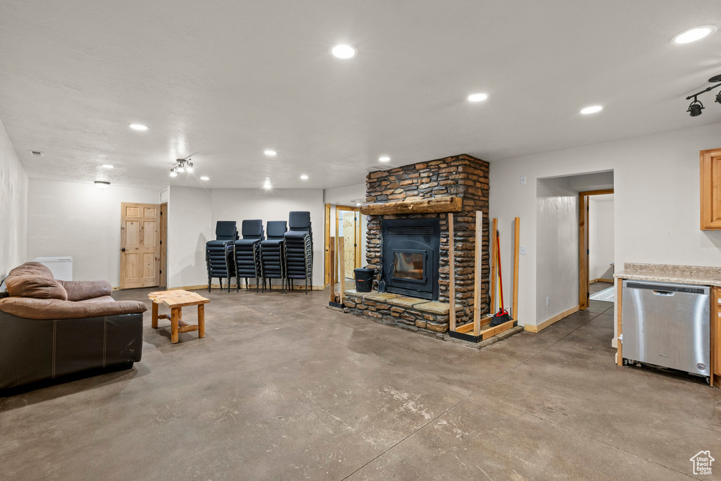 Living area with finished concrete floors and recessed lighting
