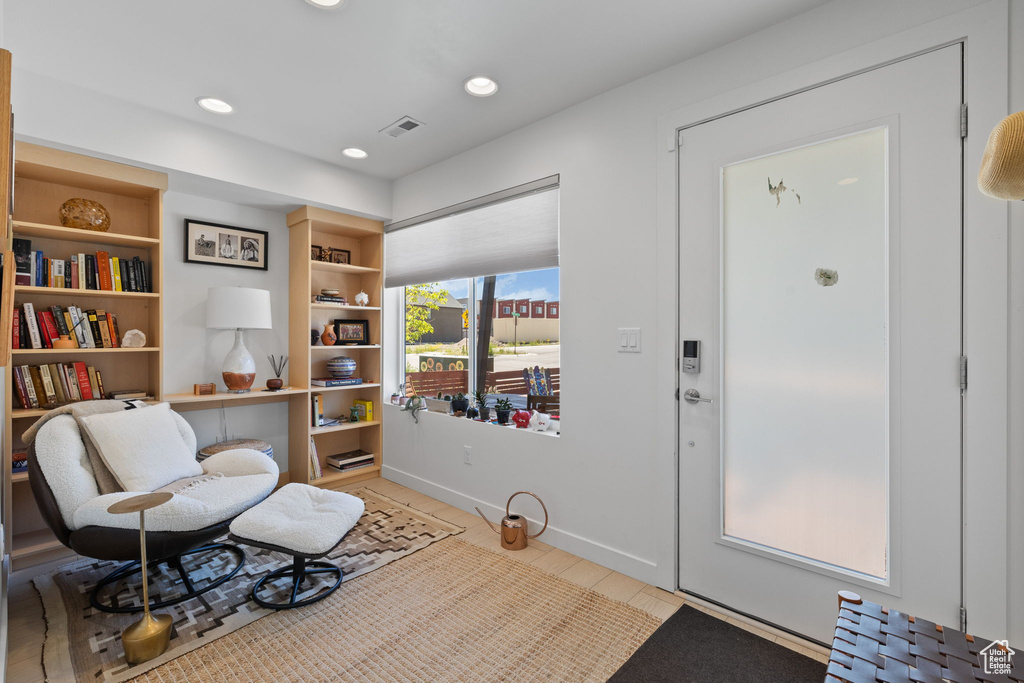 Living area with baseboards and recessed lighting