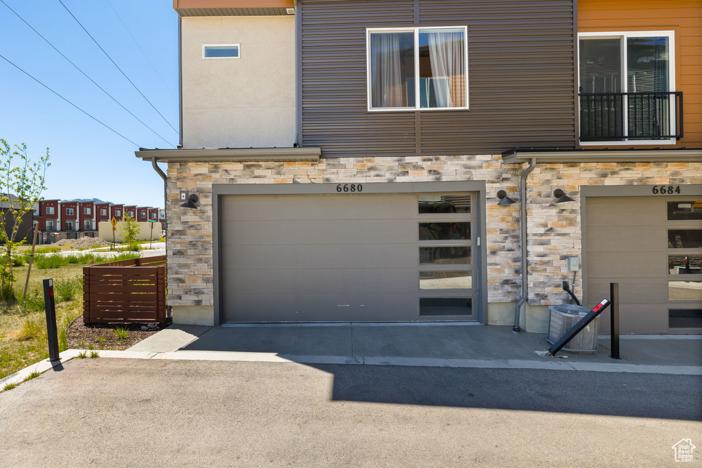 Garage with asphalt driveway