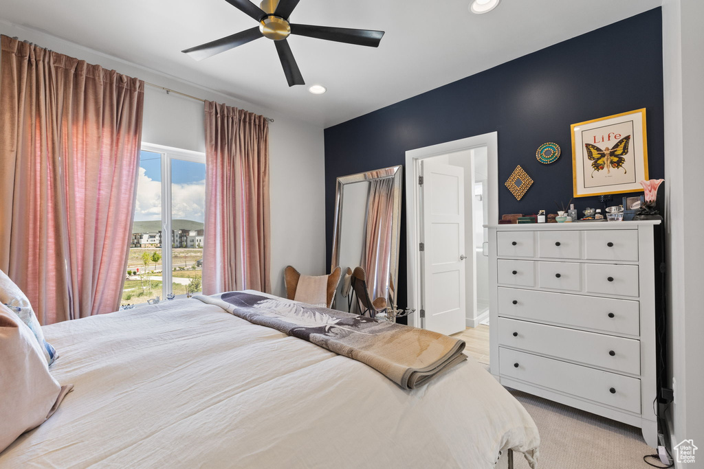 Bedroom featuring recessed lighting, ceiling fan, and light carpet