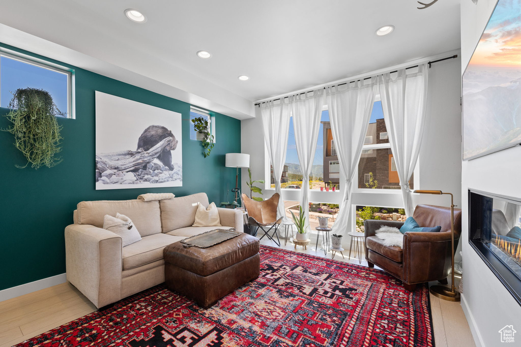 Living room with wood finished floors and recessed lighting