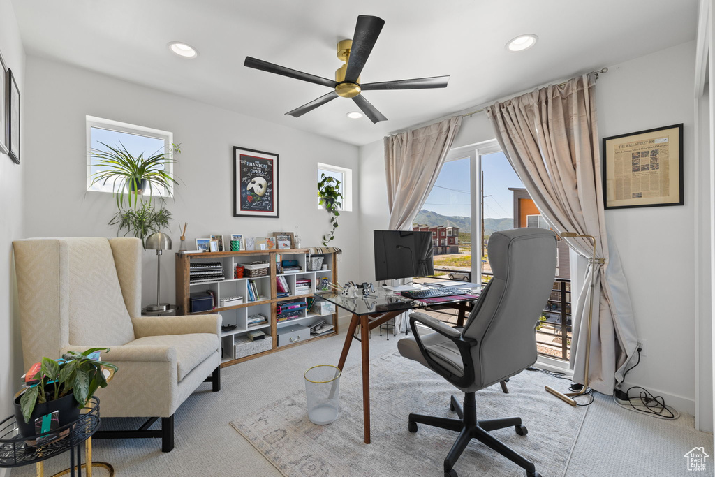 Office space featuring a ceiling fan, recessed lighting, and carpet