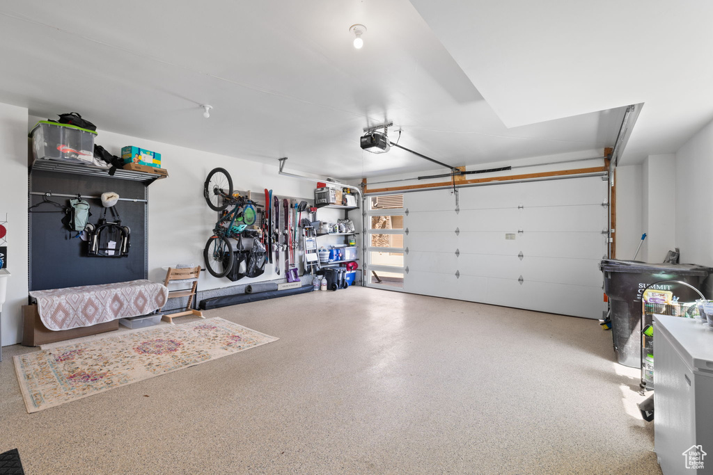 Garage featuring a garage door opener