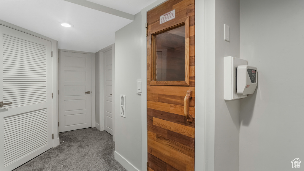 Hallway with carpet flooring and recessed lighting