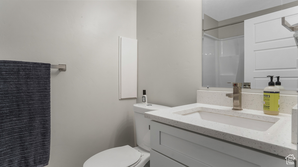 Full bath with vanity and a shower