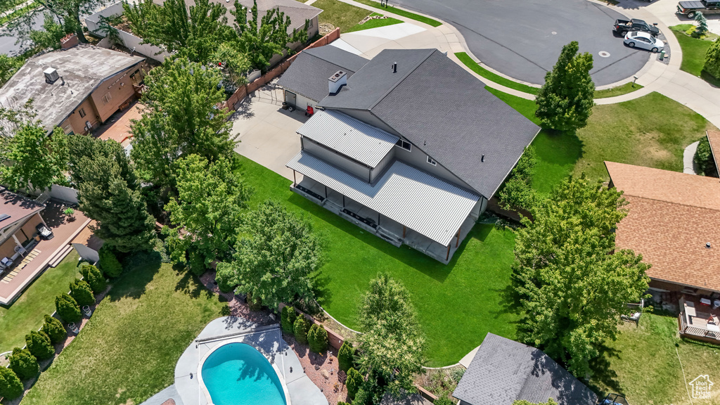 Aerial perspective of suburban area with a pool area