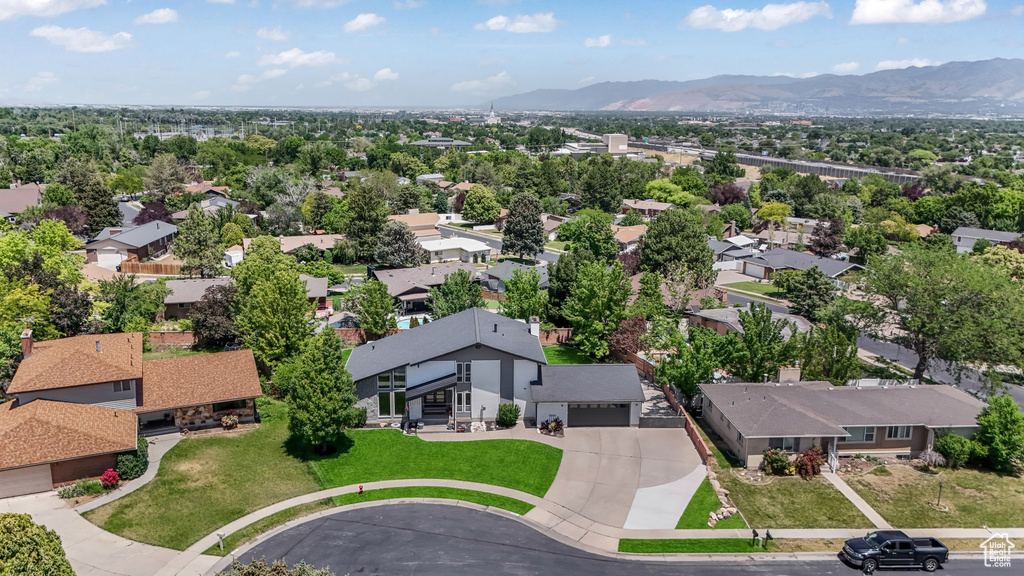 Aerial perspective of suburban area with a mountain backdrop
