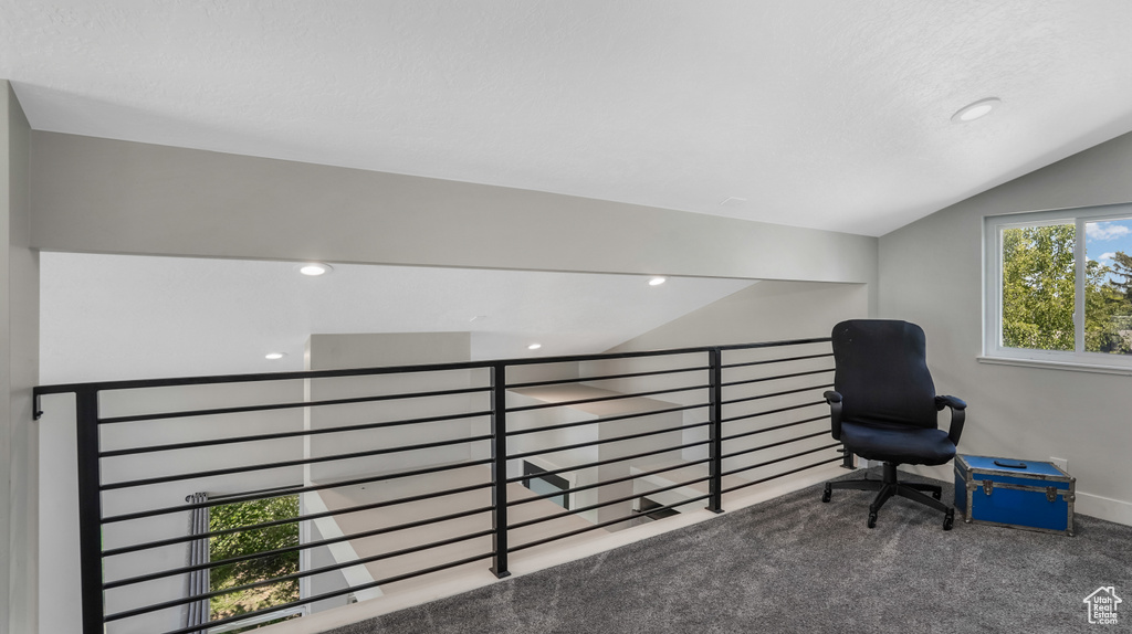 Sitting room with carpet flooring, vaulted ceiling, recessed lighting, and an upstairs landing