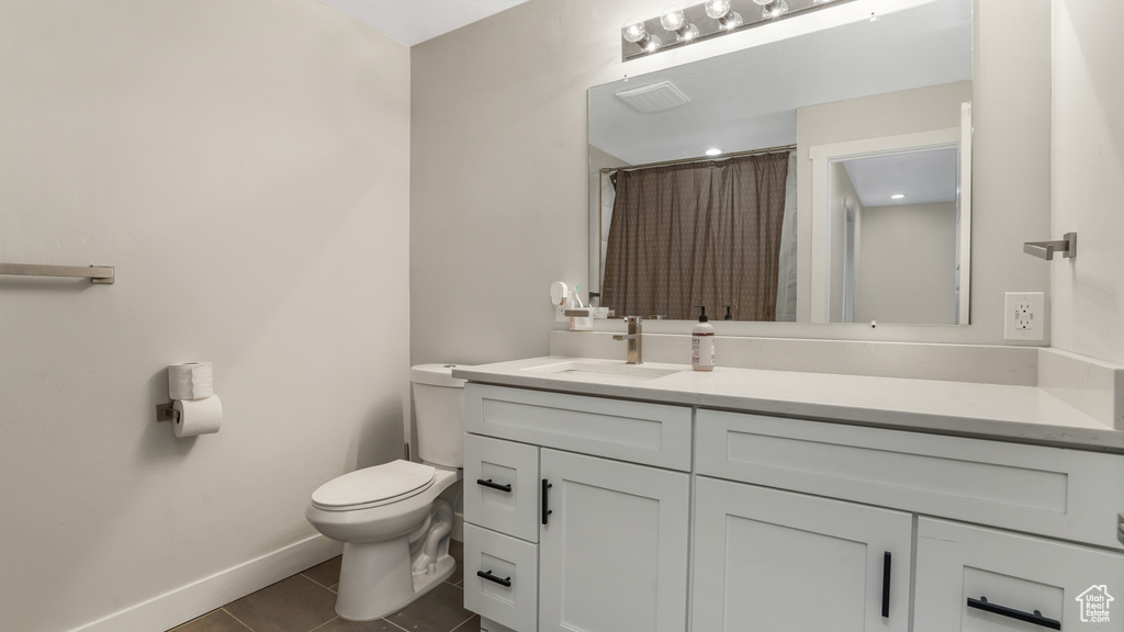 Full bath featuring vanity, tile patterned flooring, and a shower with curtain