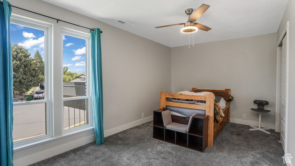 Bedroom with carpet flooring and a ceiling fan