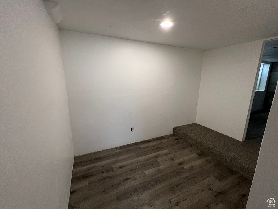 Spare room featuring wood finished floors