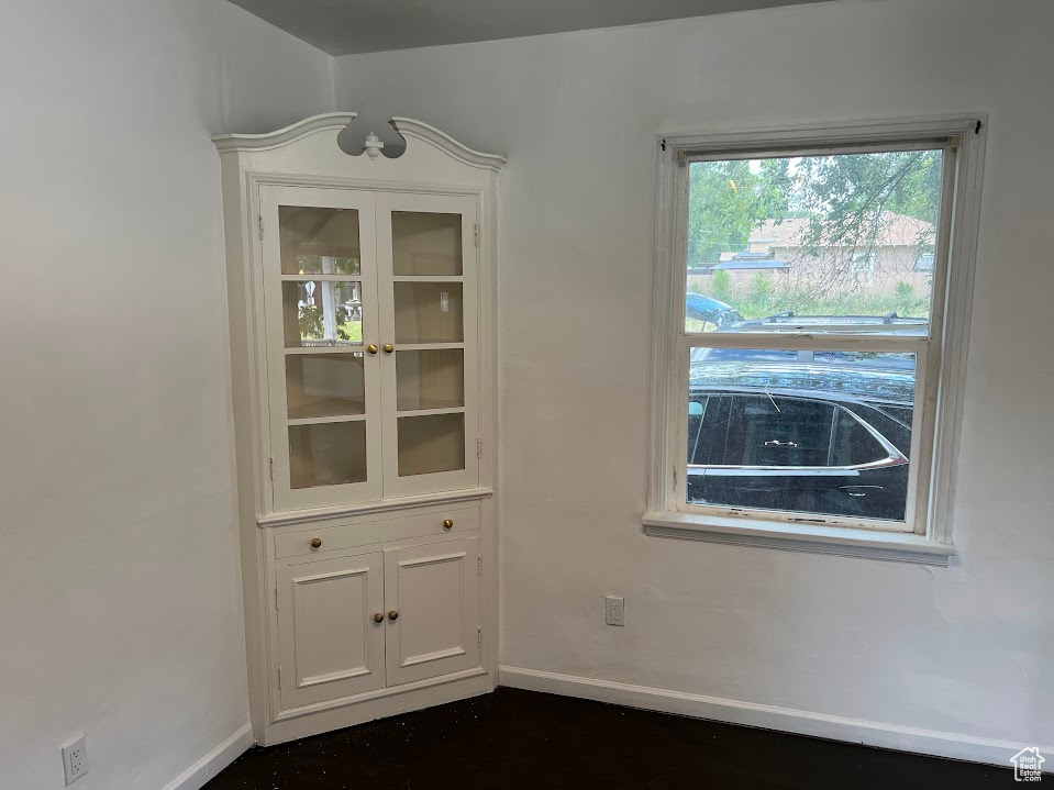 Unfurnished dining area with baseboards